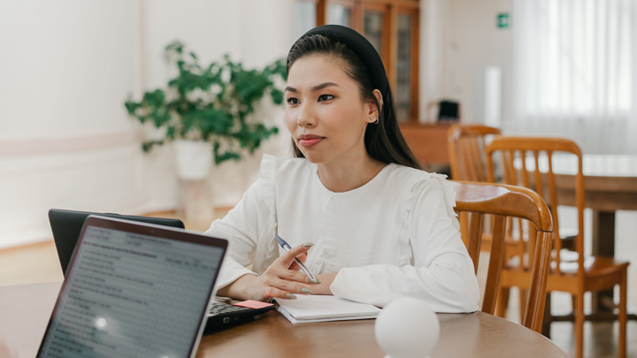 Woman at desk with laptop